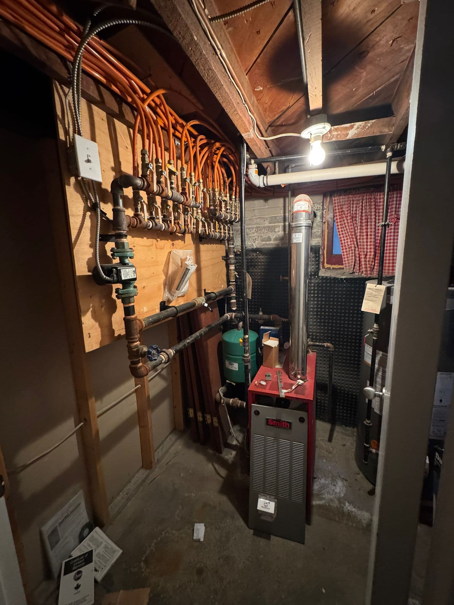 Residential boiler installation with venting, expansion tank, and gas piping